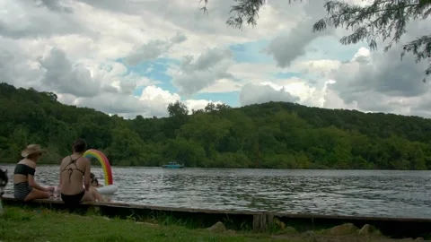 Austin, Texas - 9/2/2018: Rain clouds shadow  a calm Lake Austin on Labor Day Stock Footage 98043650