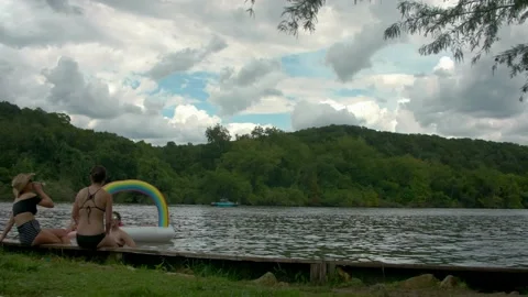Austin, Texas - 9/2/2018: Rain clouds shadow  a calm Lake Austin on Labor Day Stock Footage 98043682