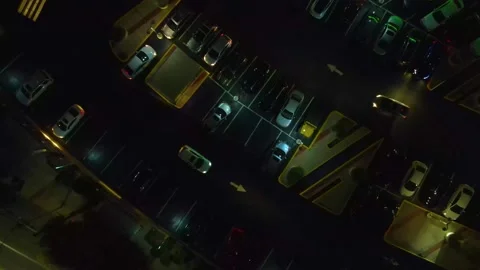 Austin Texas at night. Two vehicles pull in at the same time. The Stock Footage 221832586