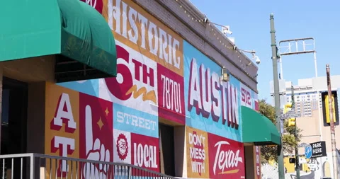 Austin's iconic and colorful Historic 6th street mural on a sunny day Stock Footage