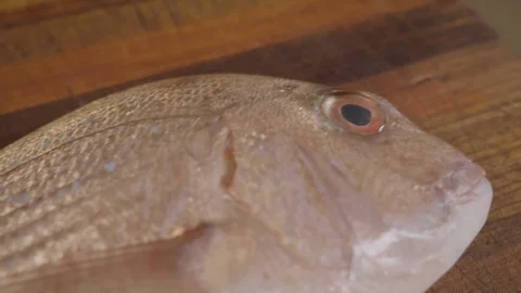 Australasian Snapper being prepared for cooking Video stock 129798853