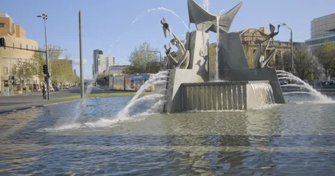 Australia Adelaide Victoria-Square-Three-Rivers-Fountain-tram-follow 422 25F Stock Footage 128714766