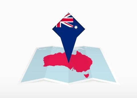 Australia is depicted on a folded paper map and pinned location marker with.. Stock Illustration