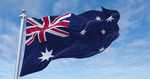 Australia flag with flagpole waving in rolling clouds looping, 4K (Perfect Loop) Video stock 277164519