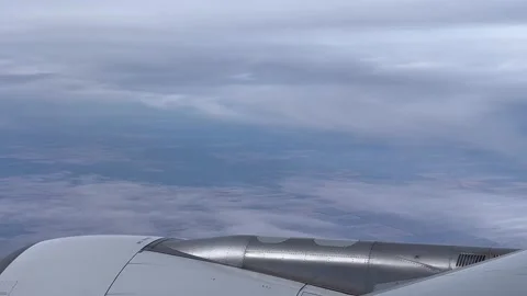 Australia: Flight above the clouds with aerial view of an aircraft engine, 4K Stock Footage 301429640