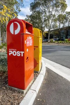 Australia Post (red) and Express Post (yellow) boxes Stock Photos