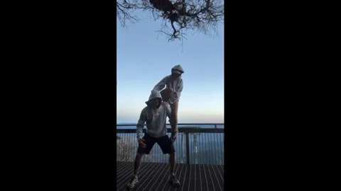 Australia: Woman falls while attempting human flag pose on Mount Warning ... Stock Footage 336297921