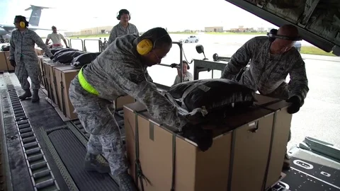 Australian Air Force loads cargo on to C-130J Hercules for Christmas Drop Stock Footage 83349961