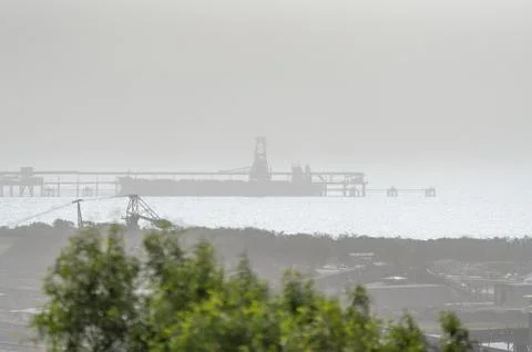 An Australian Coal Loading Terminal On A Smoke Polluted Day Stock Photos