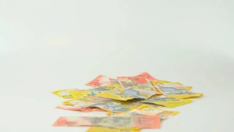 Australian Dollar Bills Falling and Accumulating on White Background 库存影片 320524307