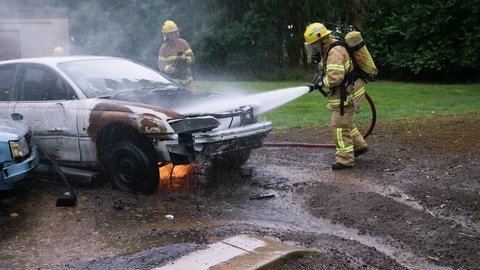 Australian firefighters training on car fire. Stock Footage 87843032