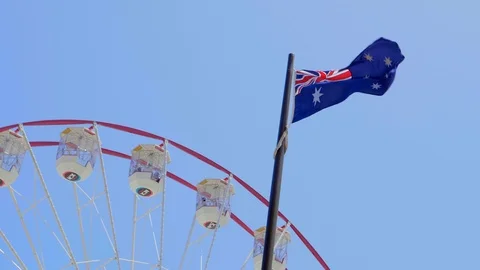 Australian flag blowing in the breeze Stock Footage 124935353