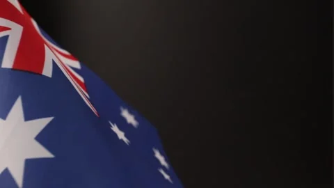 Australian flag flutters on a black background, close up Stock Footage 278025935