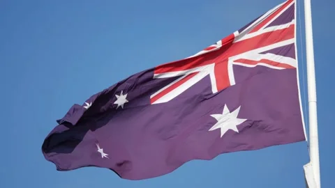 Australian Flag flying during the day in 4K Stock Footage 136824837
