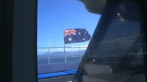 Australian flag through window of boat Stock Footage 157006