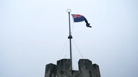 Australian flag on the tower flapping in the wind Stock Footage 97831009