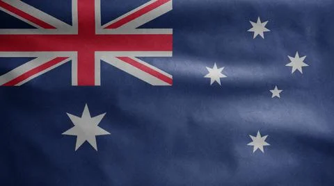 Australian flag waving in the wind. Close up of Australia banner blowing silk Ilustração Stock