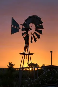 Australian windmill at sunset Stock Photos