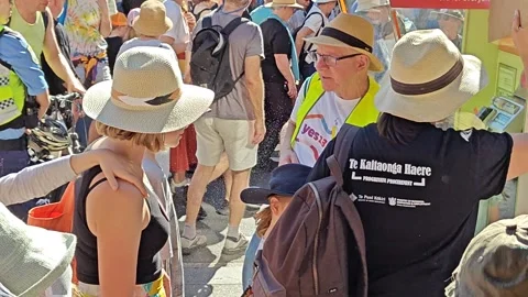 AUSTRALIANS MARCHING IN LEAD UP TO 2023 REFERENDUM MAN SPRAYING WATER 4K Stock Footage 250445877
