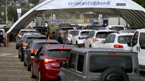 Australians wait in a queue to be tested for Covid slow motion 4K Stock Footage 156078103
