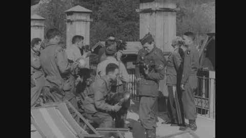 AUSTRIA GERMANY - 1945: Gateway scrum - Press crowd a stone gateway Stockbeeldmateriaal 344006034