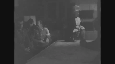 AUSTRIA GERMANY - 1945: Map conference - Officers study a map at a table Stock Footage 344006025