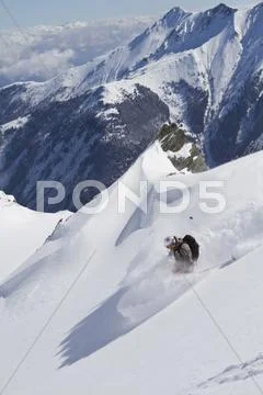 Austria, Kaprun, Kitzsteinhorn, Man Skiing In Powder Snow