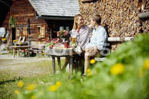 Austria, Salzburg State, Altenmarkt-Zauchensee, couple having an alpine picnic Stock Photos