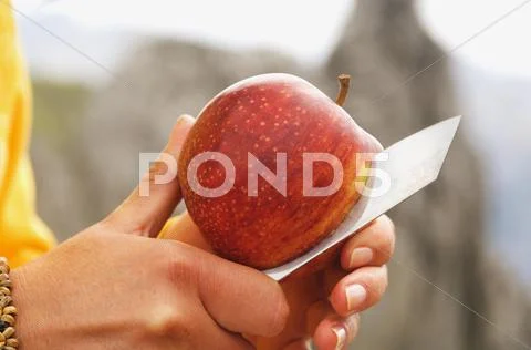 Austria, Salzburger Land, slicing an apple Stock Photos