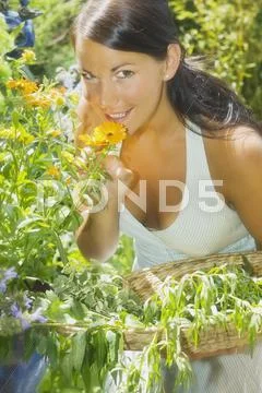 Austria, Salzburger Land, Woman in garden, portrait Stock Photos