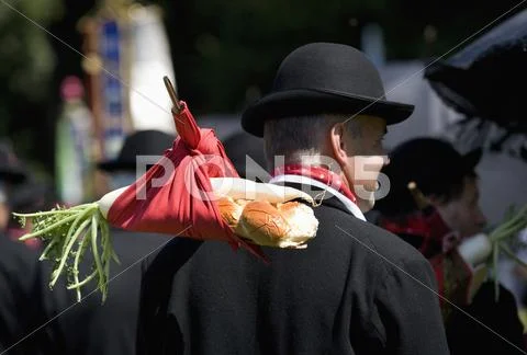 Austria, Upper Austria, Mature Man in traditional costume carrying snack Stock Photos