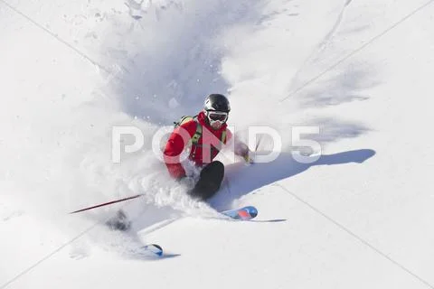 Austria, Zuers, Young Man Doing Telemark Skiing On Arlberg Mountain