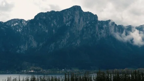 Austrian Alps mountains with town view pan right Video stock 74923030