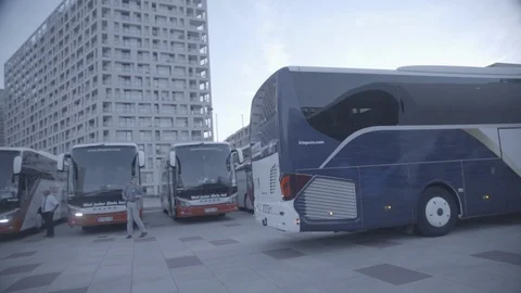 Austrian coach pulling up at Austria Centre, Vienna, Slow motion Stock Footage 98764320
