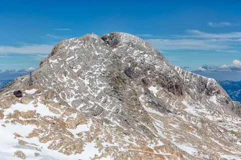 Austrian Dachstein mountain peak with bare rocks and clear sky Stock Photos