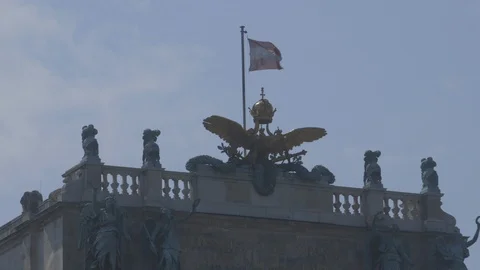 Austrian flag on top of the Vienna Hofburg Stock Footage