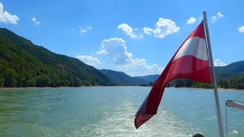Austrian flag waving over Danube (long) Stock Footage 81302131