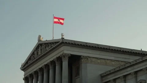 Austrian flag waving  wind  parlament government building capital city Vienna Video stock 82534142