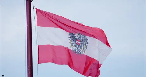 Austrian flag waving in the wind, Vienna Stockbeeldmateriaal 251891929