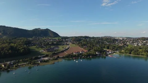 Austrian Lake Surrounded by Mountains and Lakeside Villages 스톡 동영상 345176817