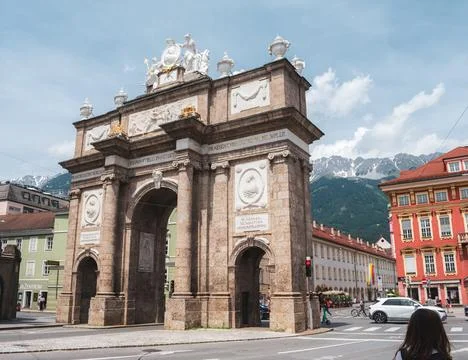 Austrian Landmark Triumphpforte Framed by Alps and City Stock Photos