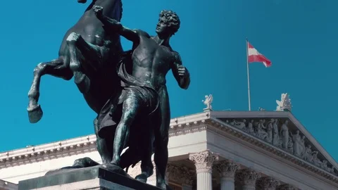Austrian parliament building with flag. Video stock 73511215
