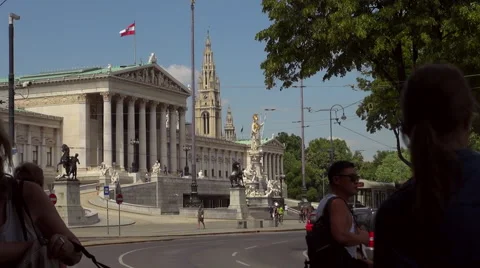 Austrian Parliament with Old fashioned tram, Red tram at Ringstrasse Stock Footage 67589849
