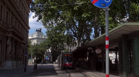 Austrian Parliament with Old fashioned tram, Red tram at Ringstrasse Stock Footage 67589919
