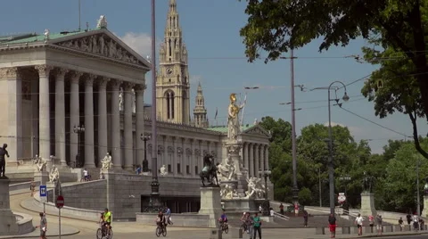 Austrian Parliament with Old fashioned tram, Red tram at Ringstrasse Stock Footage 67589939