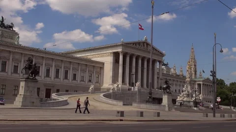 Austrian Parliament with Old fashioned tram, Red tram at Ringstrasse Stock Footage 67590101