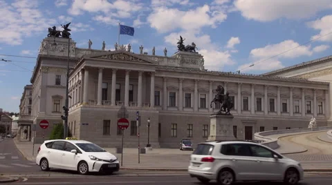 Austrian Parliament with Old fashioned tram, Red tram at Ringstrasse Stock Footage 67590111