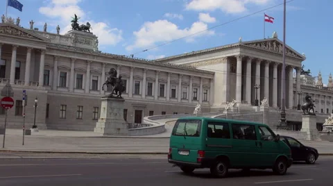 Austrian Parliament with Old fashioned tram, Red tram at Ringstrasse Stock Footage 67590158