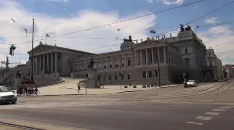 Austrian Parliament with Old fashioned tram, Red tram at Ringstrasse Stock Footage 67608375