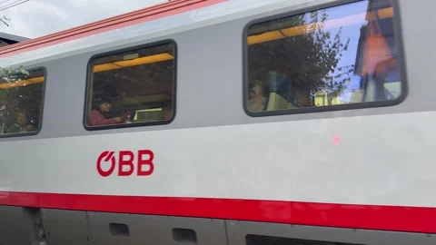 Austrian Railways (OBB)  train passes through Zell am See town. Austria Stock Footage 315669068